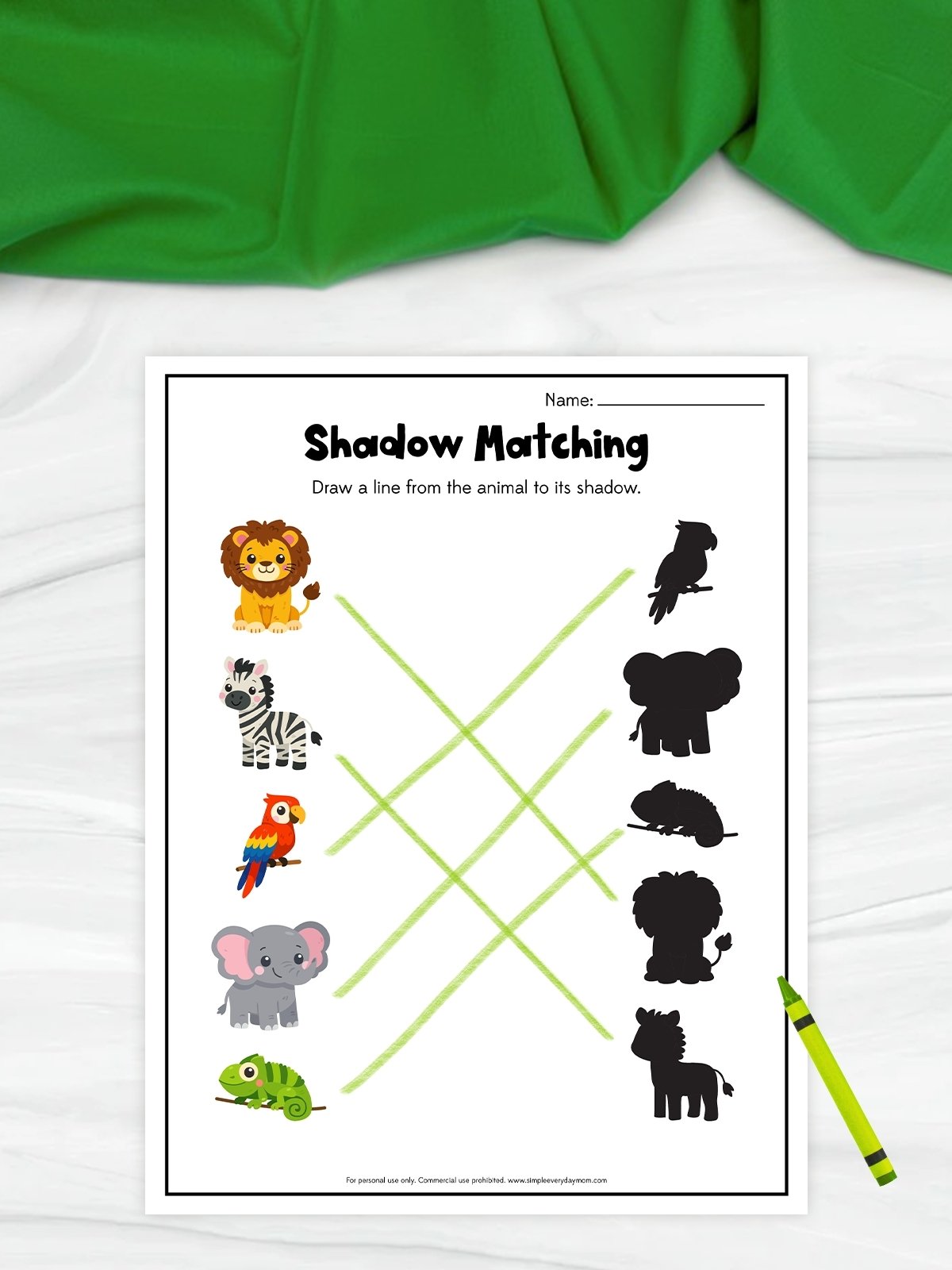 This image shows a printable “Shadow Matching” worksheet for children that helps develop observation and matching skills. The activity features colorful animals on the left side and their black shadow silhouettes on the right, connected by light green matching lines. A bright green crayon beside the worksheet and the playful animal illustrations give the page a fun and educational look for young learners.