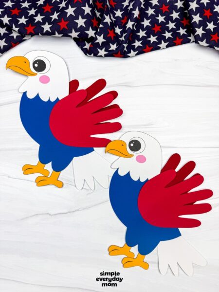 A completed craft showing two American eagle handprint crafts with red wings, blue bodies, and white tail feathers on a patriotic themed background.