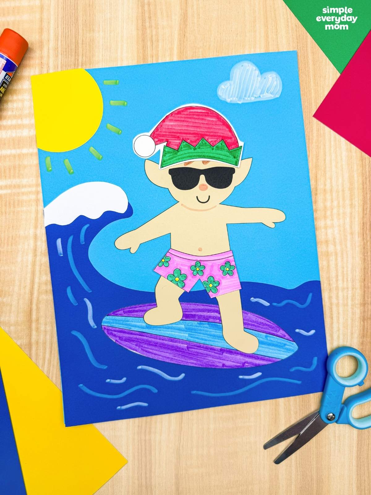 A completed Craft featuring an elf in sunglasses, a Santa hat, and pink floral swim trunks surfing on a purple and blue surfboard with ocean waves, a sun, and a cloud.