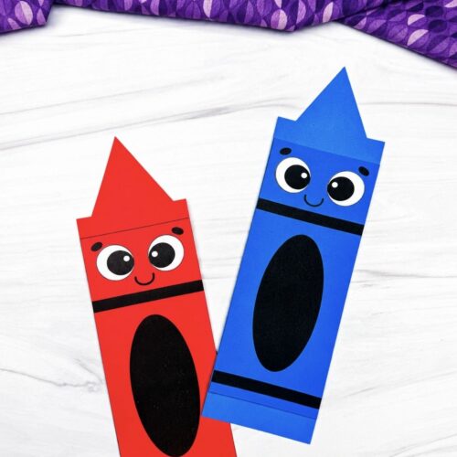 A completed red and blue crayon shape crafts with smiling faces displayed side by side.
