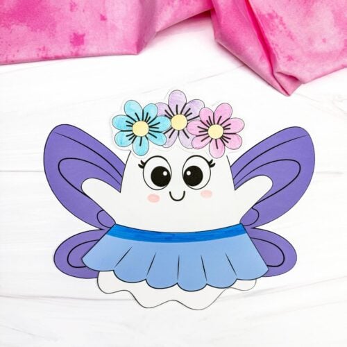 A completed craft of the Fairy Ghost Disguise Craft with purple fairy wings, a flower crown, and a blue skirt.