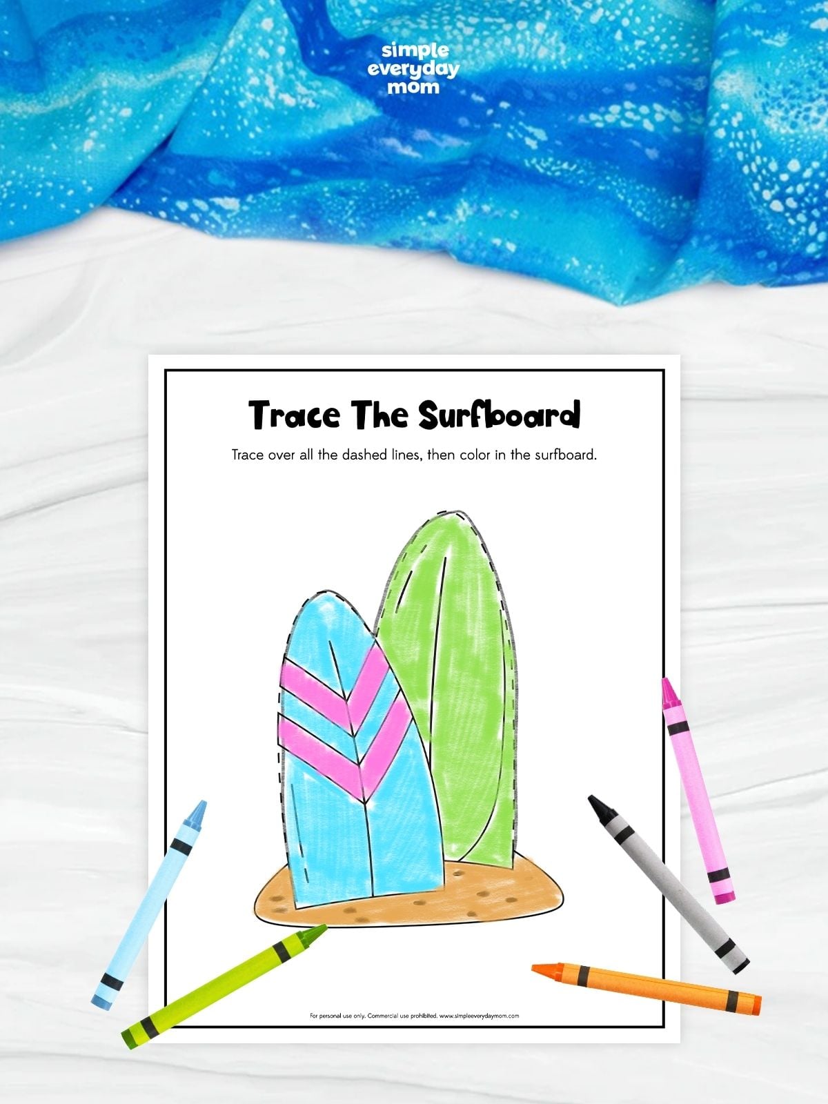 A summer-themed tracing worksheet featuring two surfboards on the beach with dashed outlines for children to trace. Kids trace the surfboards and color the picture to build pencil control, fine motor skills, hand-eye coordination, and early pre-writing skills.