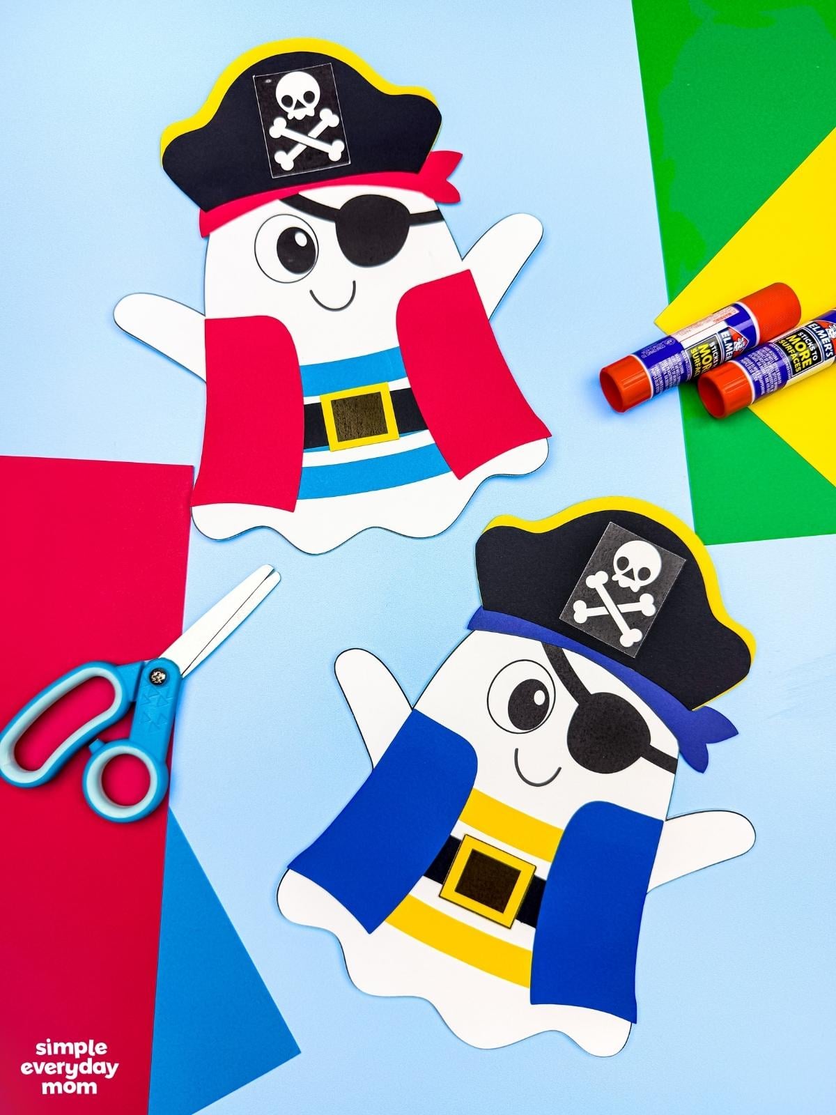 Collage of two completed pirate ghost disguise crafts displayed with colorful paper, scissors, and glue sticks.