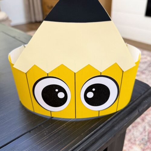 A completed craft of a printable pencil headband displayed on a tabletop.