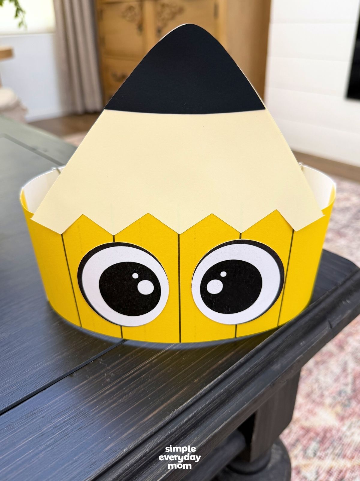 A completed craft of a printable pencil headband displayed on a tabletop.