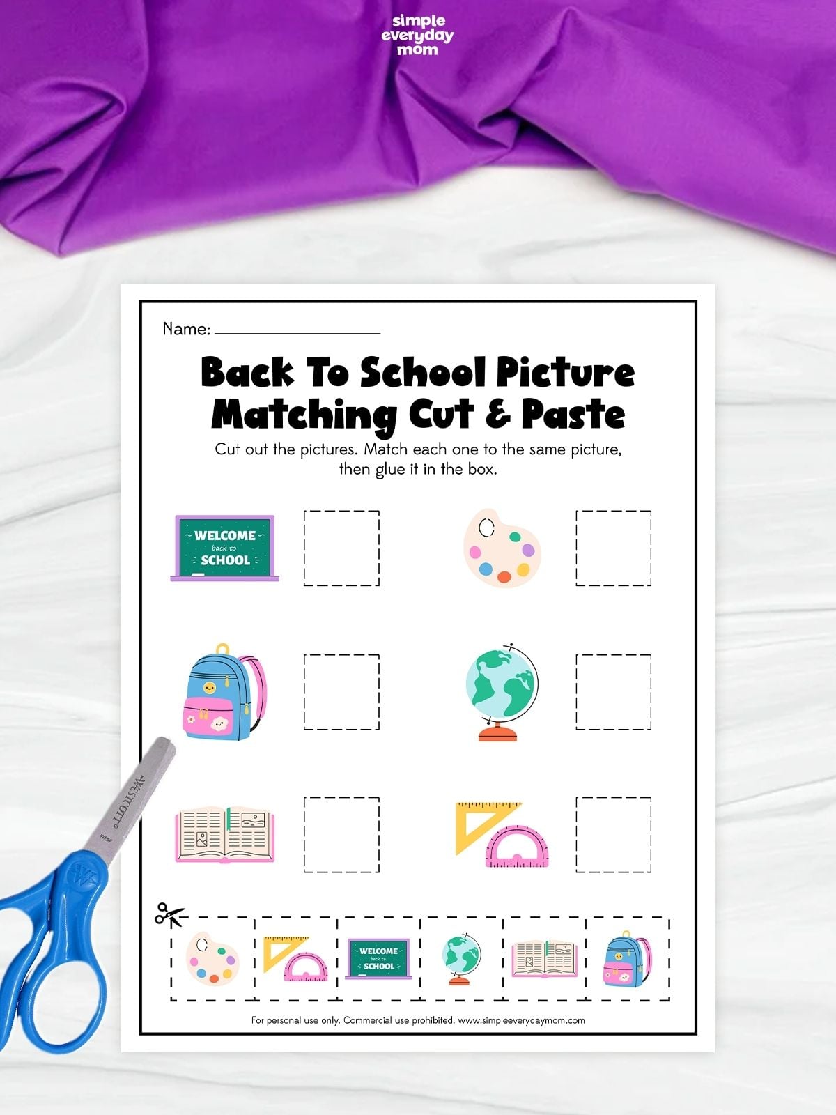 Back-to-school picture-matching cut-and-paste worksheet featuring a chalkboard, paint palette, backpack, globe, book, and geometry tools with matching cutout images at the bottom.