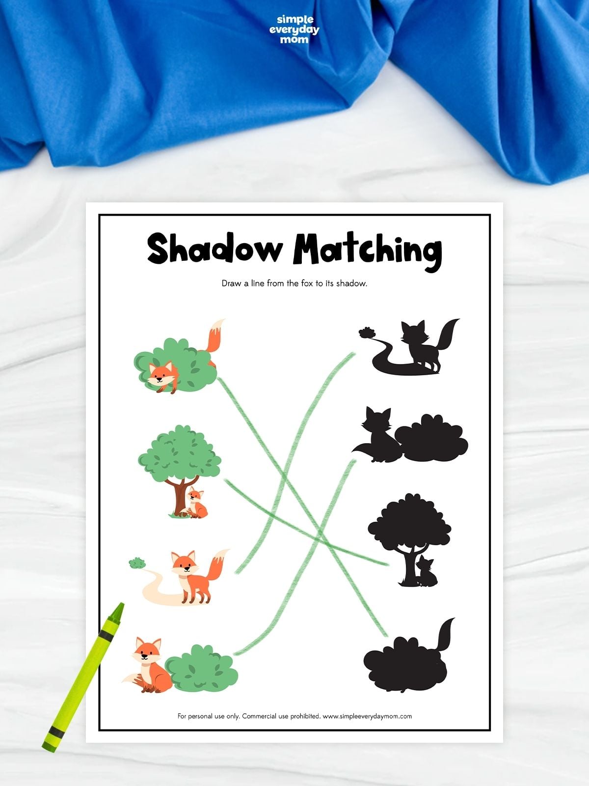 A fox shadow matching worksheet with four colorful fox scenes and matching black silhouettes. Children draw lines to connect each fox picture to its correct shadow. A green crayon rests beside the completed matching activity.