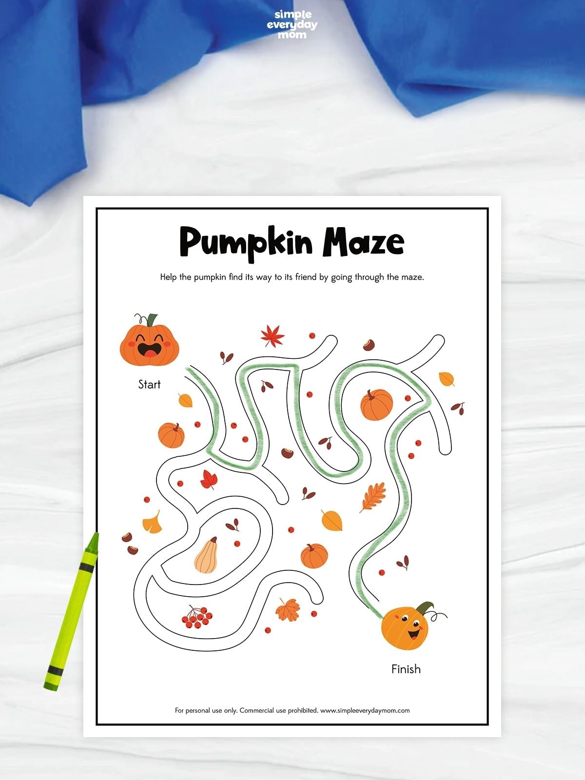Pumpkin maze worksheet with a green path traced from a smiling pumpkin at the start to a pumpkin friend at the finish, surrounded by autumn leaves, berries, acorns, and gourds.