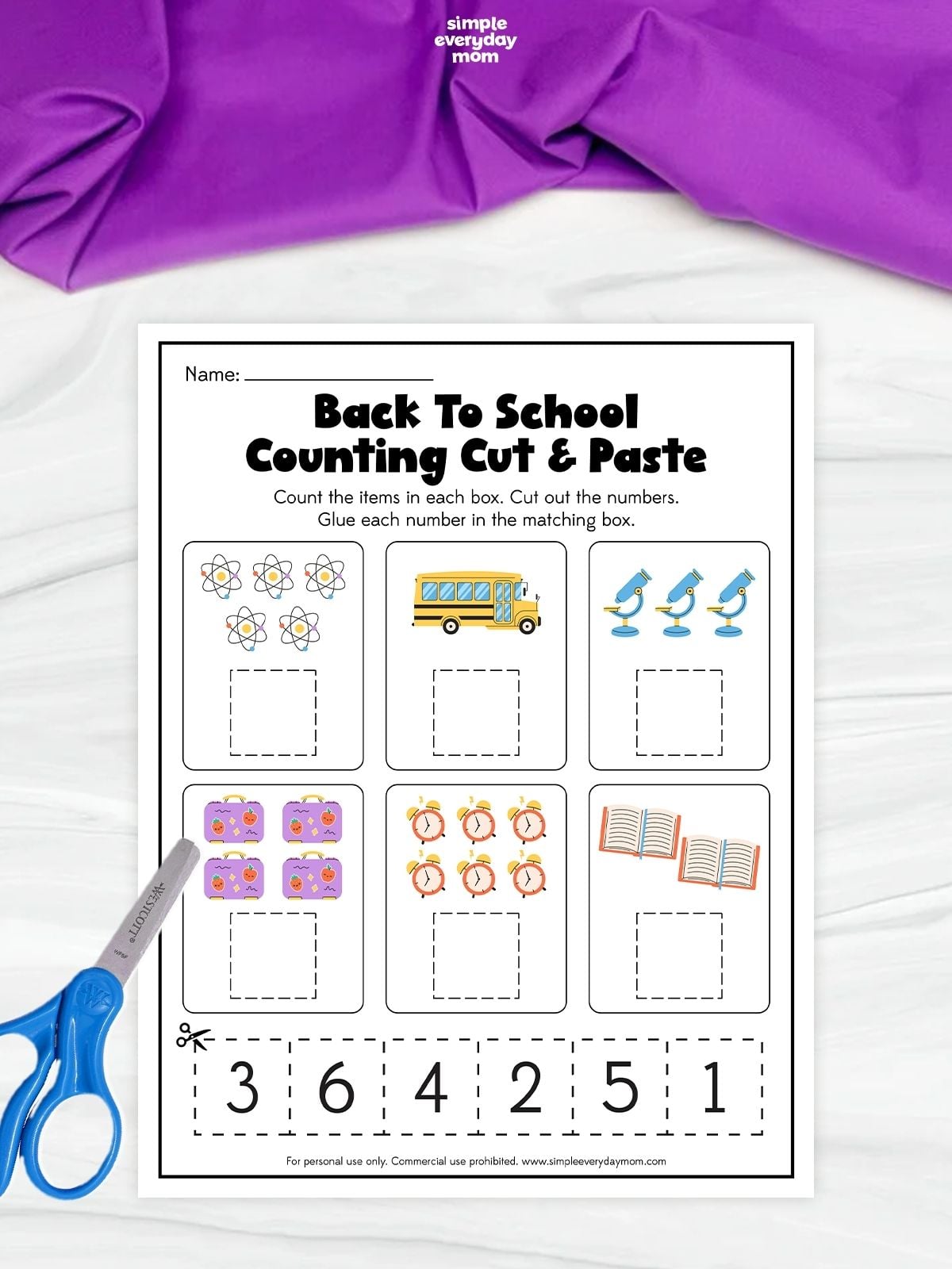 Back-to-school counting cut-and-paste worksheet with groups of atoms, a school bus, microscopes, lunchboxes, clocks, and books to count, plus number cutouts 1–6 at the bottom for matching.