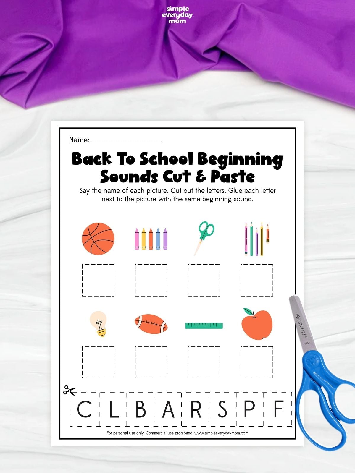 Back-to-school beginning-sounds cut-and-paste worksheet featuring pictures of a basketball, crayons, scissors, pencils, light bulb, football, ruler, and apple, with letter cutouts at the bottom for matching.