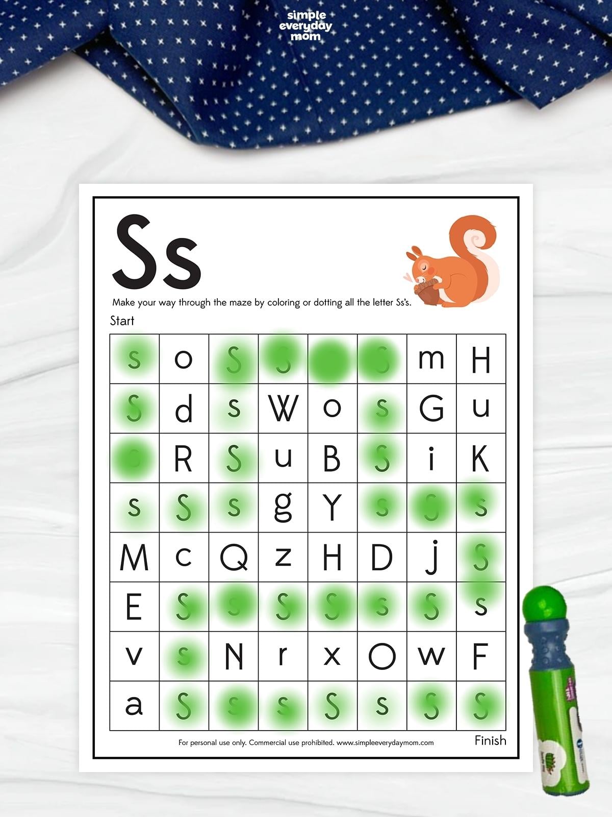 Letter S maze worksheet featuring uppercase and lowercase S, with a squirrel illustration and a green dotted path connecting the letter S from start to finish.
