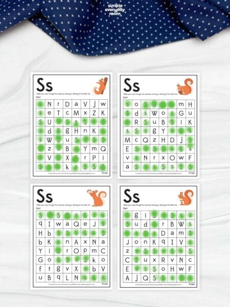 Four letter S maze worksheets arranged in a grid, each featuring a squirrel illustration and mixed-letter maze with green dotted paths connecting uppercase and lowercase S letters.