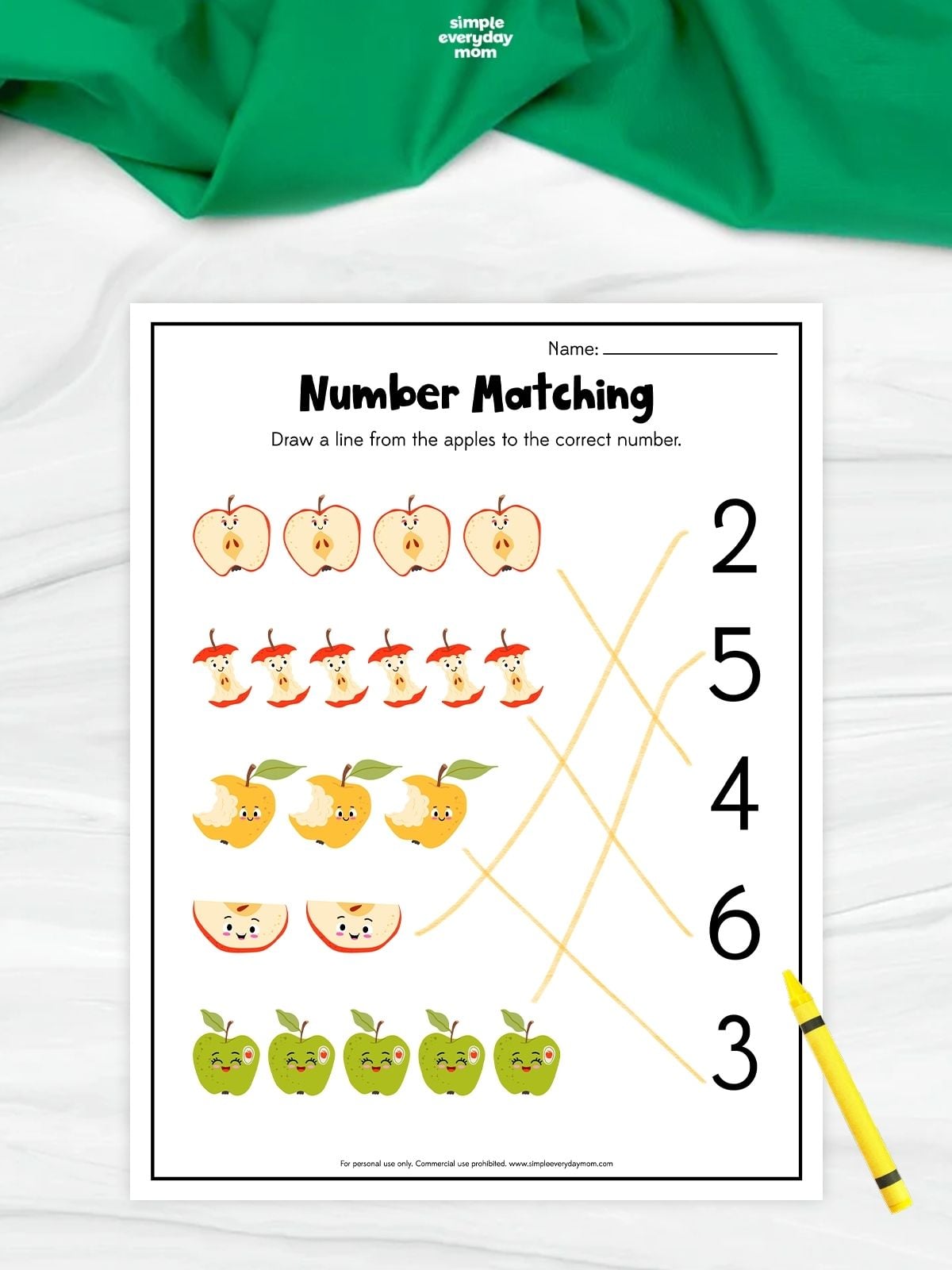 Apple number matching worksheet with groups of two to six apple illustrations connected by lines to their corresponding numbers.