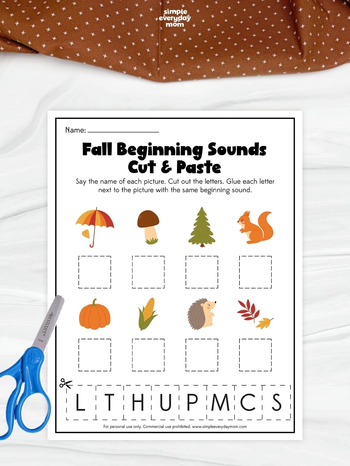 A fall beginning sounds cut and paste worksheet for kindergarten featuring seasonal pictures and letter matching for early literacy and phonics practice.