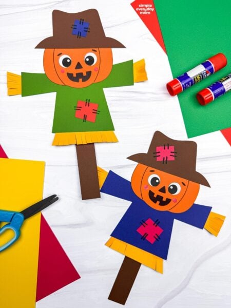 A completed Craft showing two pumpkin head scarecrows with hats, patched shirts, and straw details.