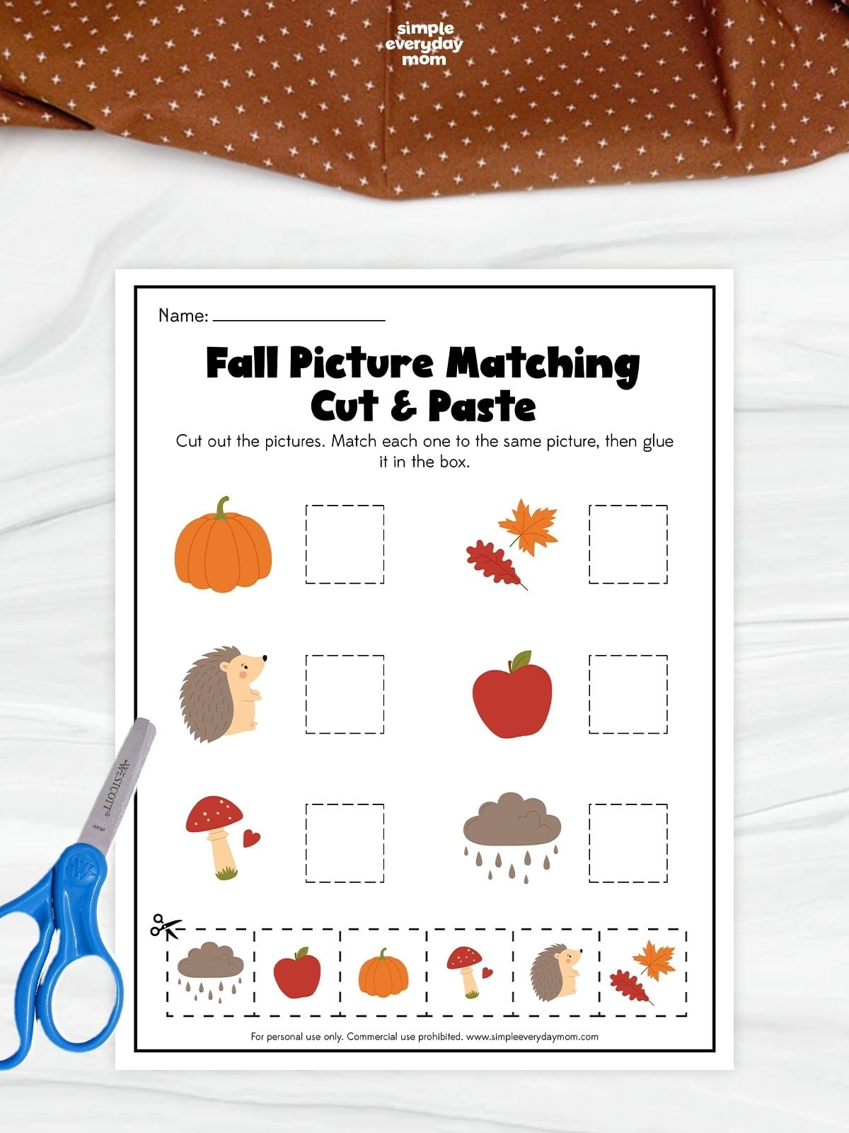 A fall picture matching cut and paste worksheet for preschool featuring pumpkins, leaves, a hedgehog, apple, mushroom, and rain cloud for fine motor practice.