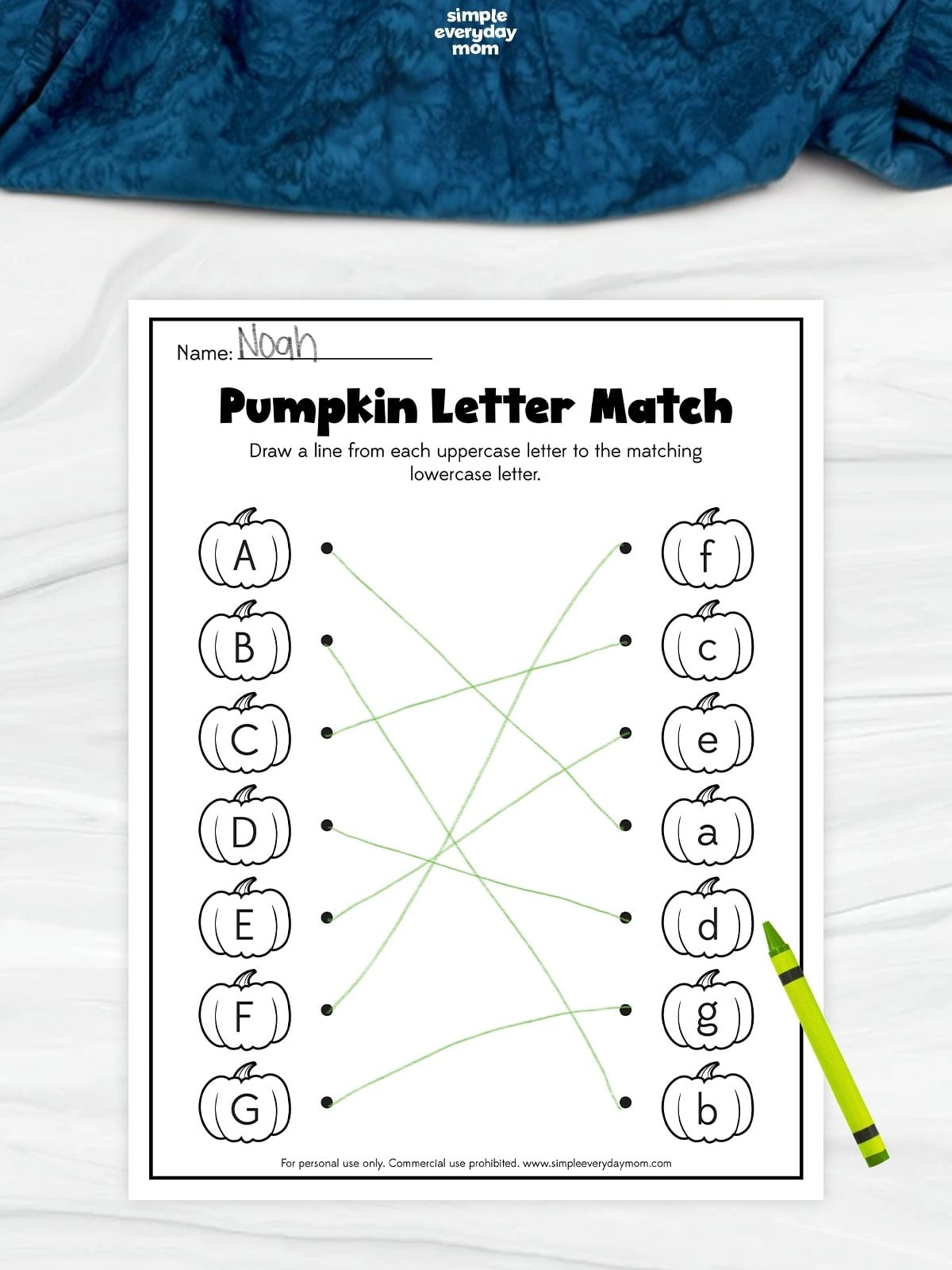 Pumpkin letter matching worksheet with uppercase letters A–G connected by green lines to their matching lowercase letters on pumpkin shapes.