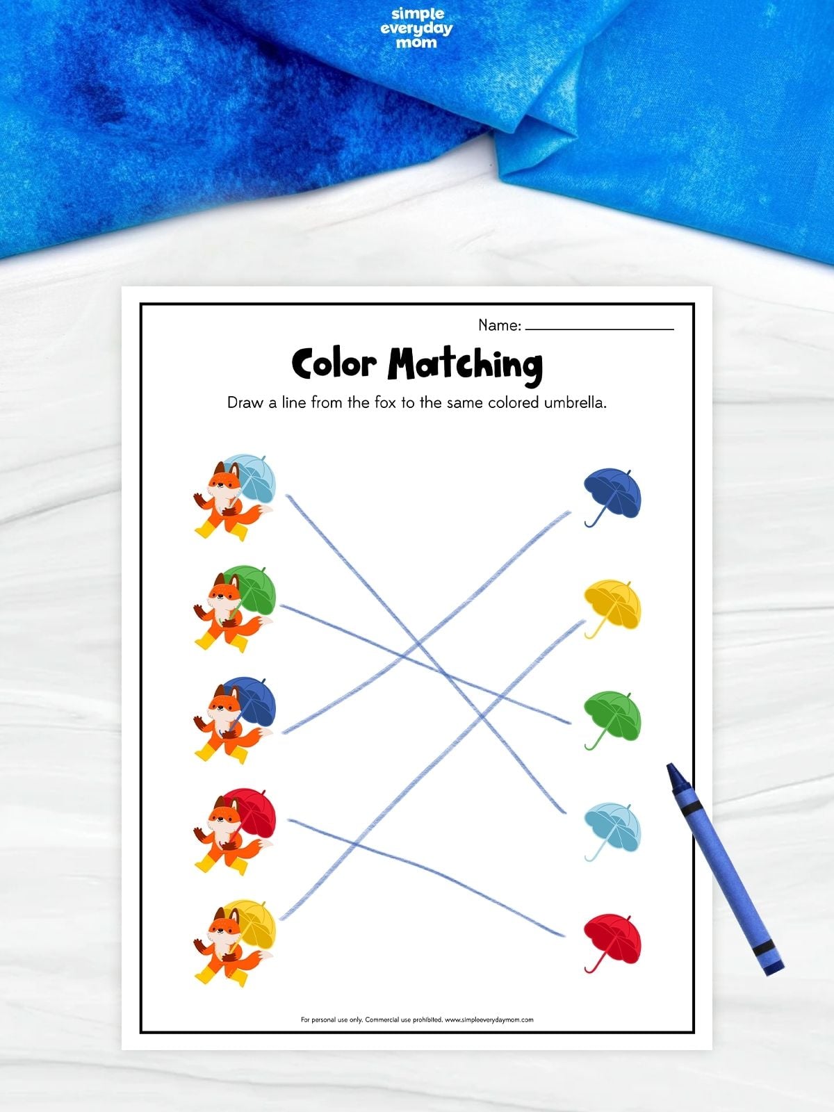 Fox-themed color matching worksheet with five foxes holding colored umbrellas and lines connecting each fox to the matching blue, yellow, green, light blue, or red umbrella.