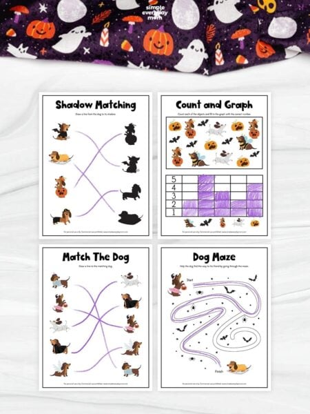 Four completed Halloween-themed dog activity worksheets arranged in a grid: shadow matching, counting and graphing, matching costumed dogs, and a dog maze. Purple crayon marks show the completed answers on each worksheet.