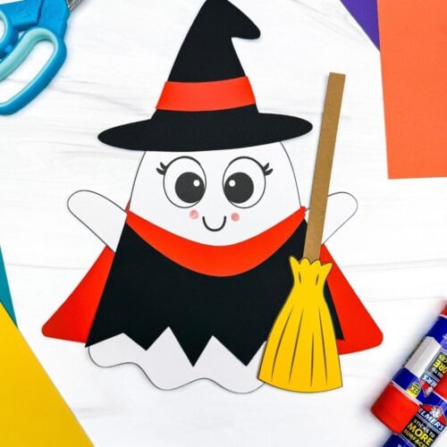 A completed craft showing a Witch Ghost Disguise with a witch hat, dress, and broom surrounded by craft supplies.
