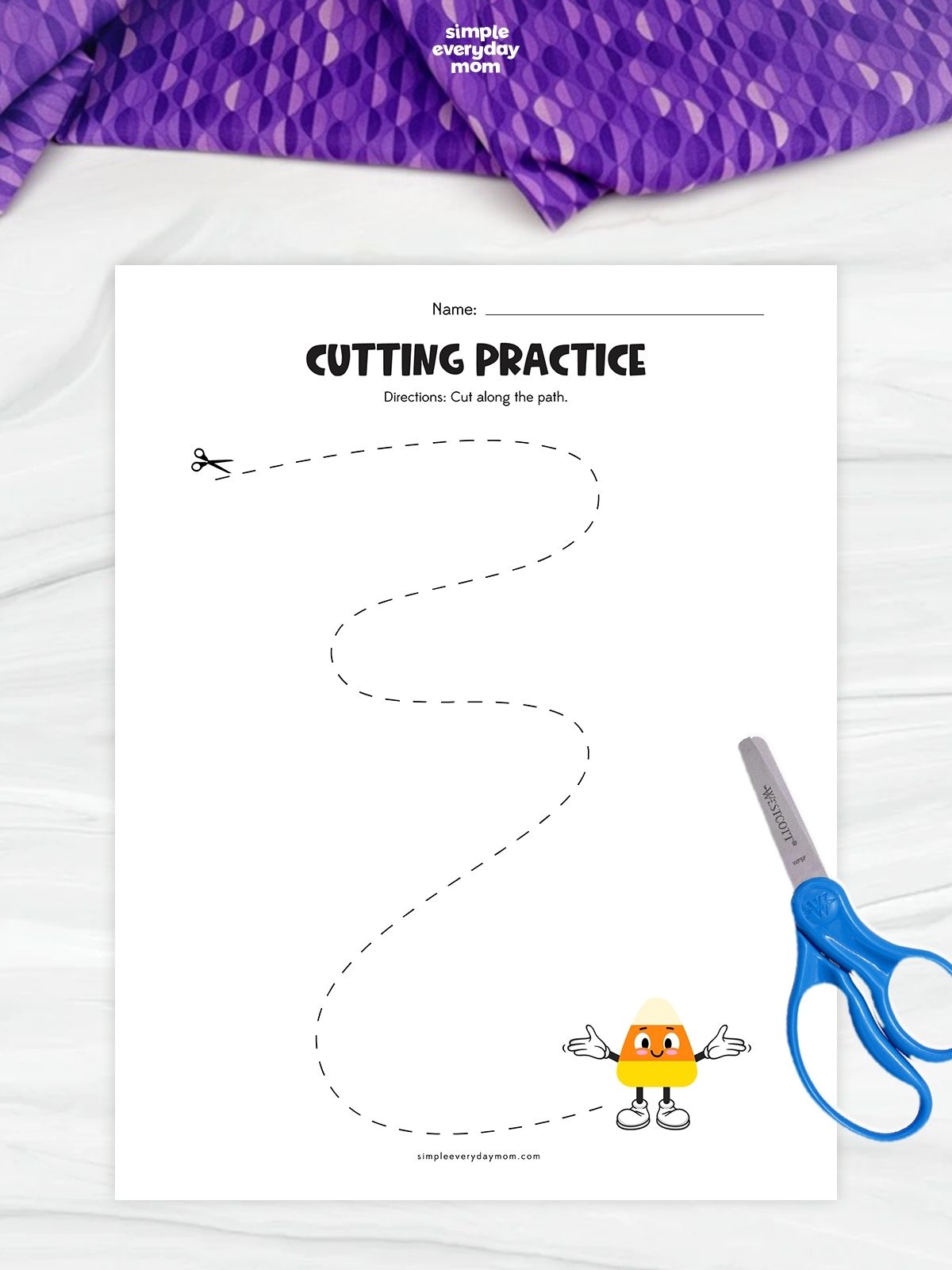 Hands-on Candy Corn Cutting Practice Worksheet featuring a curved path for kids to follow with scissors.