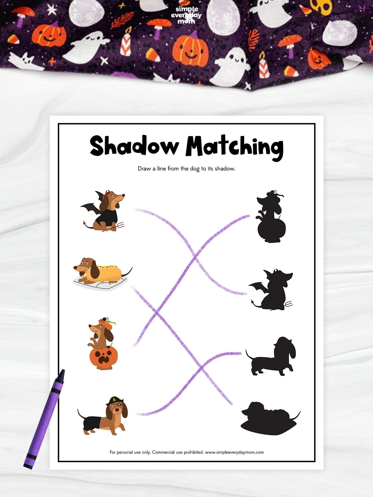 Halloween-themed shadow-matching worksheet featuring four cartoon dogs in costumes, including a devil, hot dog, pumpkin, and pirate. Purple lines connect each dog to its matching black silhouette.