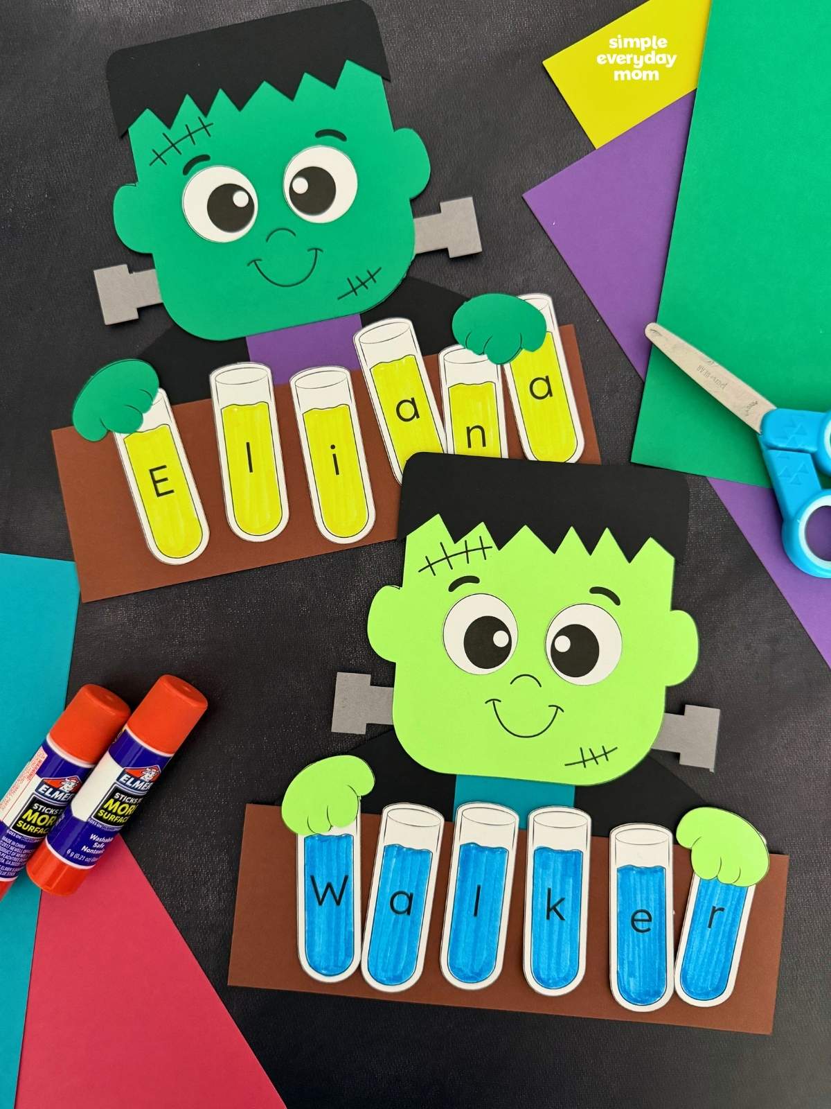 Side by side completed Frankenstein name crafts with lettered test tubes spelling each child’s name.