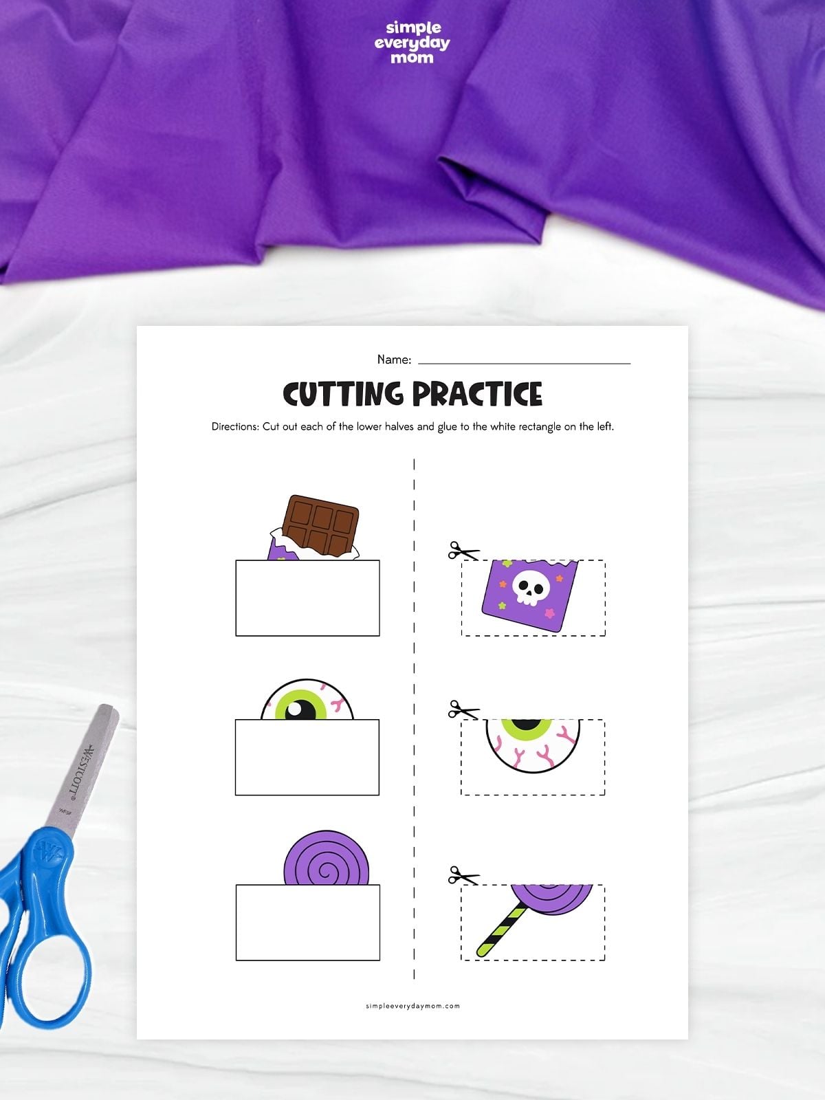 Halloween-themed cutting practice worksheet where children cut out and match the lower halves of a chocolate bar, eyeball, and purple lollipop to complete each picture.