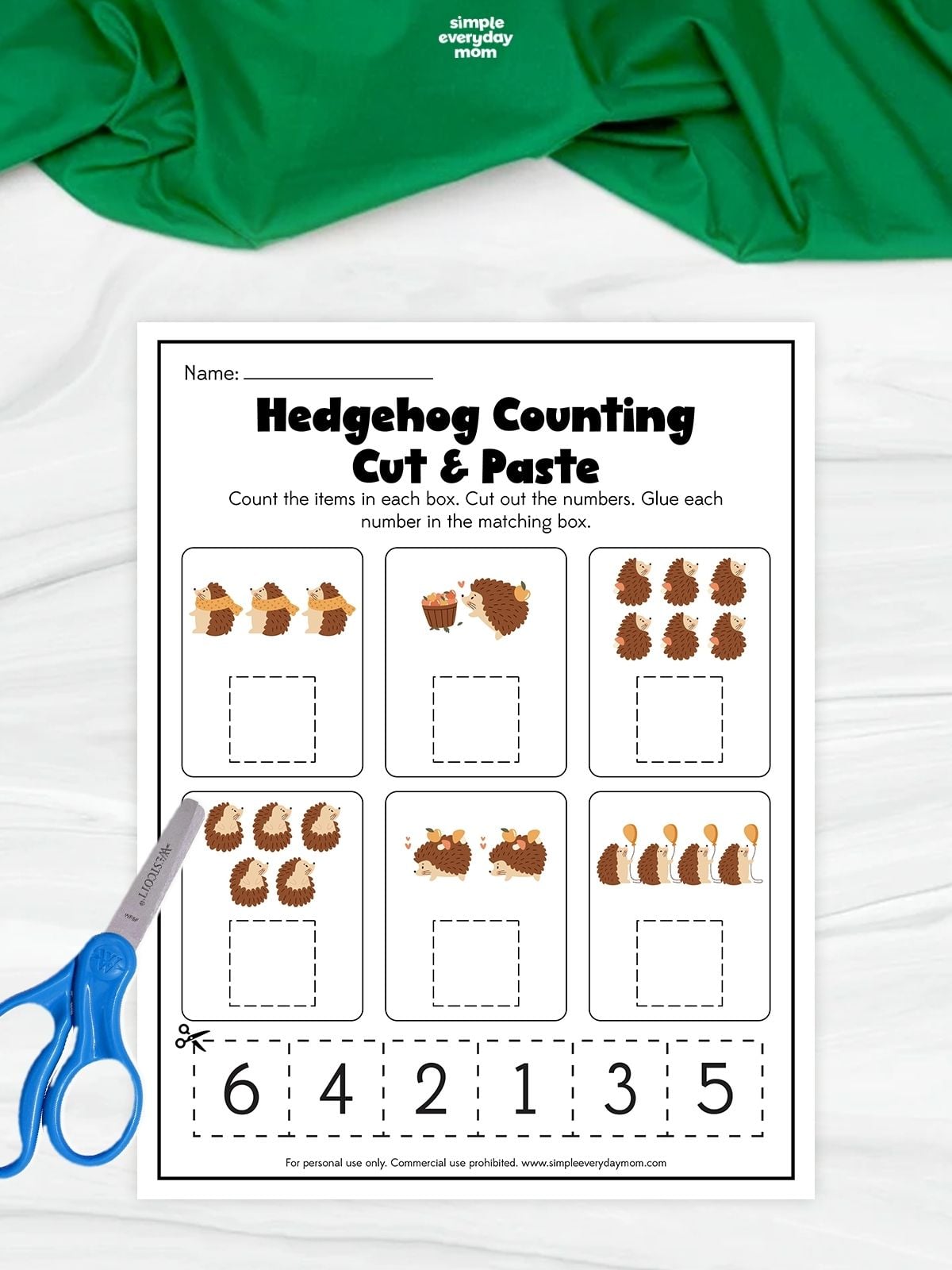A printable hedgehog counting cut and paste worksheet with numbers 1 through 6 for kindergarten math and scissor practice.