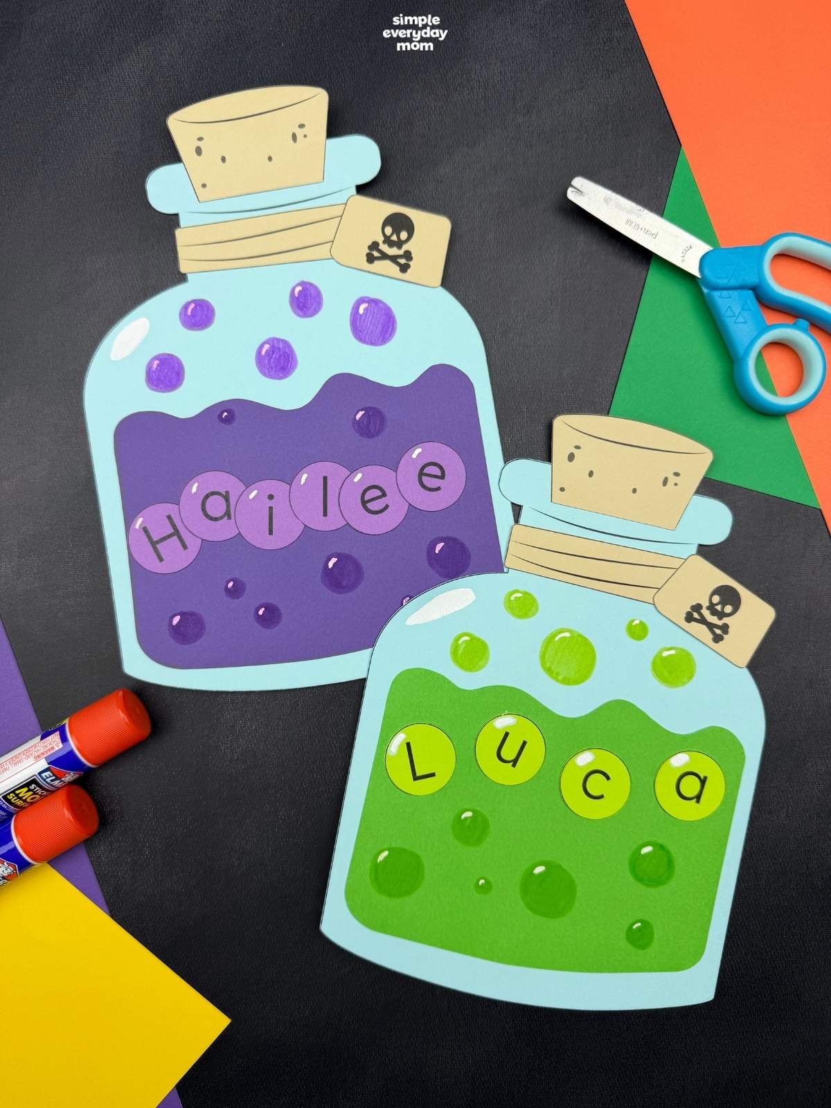 A completed Craft featuring two Halloween potion name bottles with colorful bubbles, corks, and skull tags.