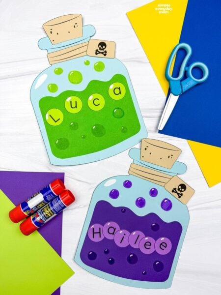 A completed Craft featuring two colorful Halloween potion name bottles with bubbles, corks, and skull tags.