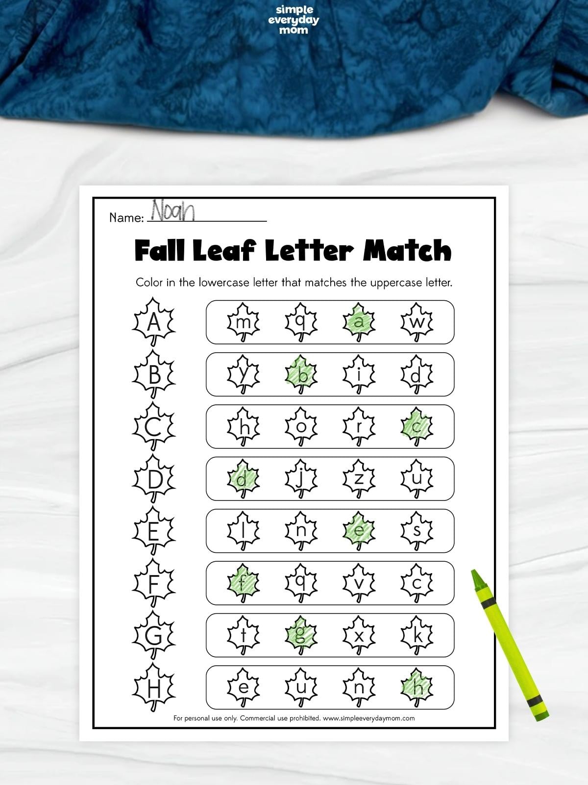 Fall leaf letter matching worksheet with uppercase letters A–H and rows of lowercase letters, with the matching lowercase leaf in each row colored green.