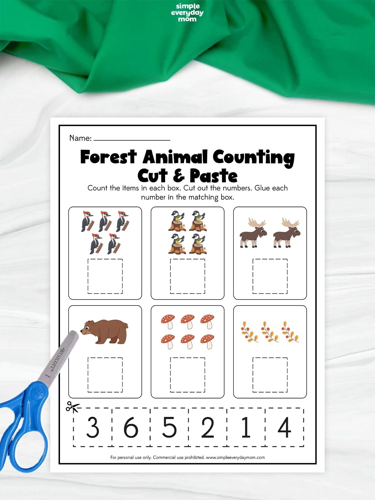 Forest animal counting cut-and-paste worksheet with groups of woodpeckers, birds, moose, a bear, mushrooms, and branches to count and match with the numbers 1 through 6.