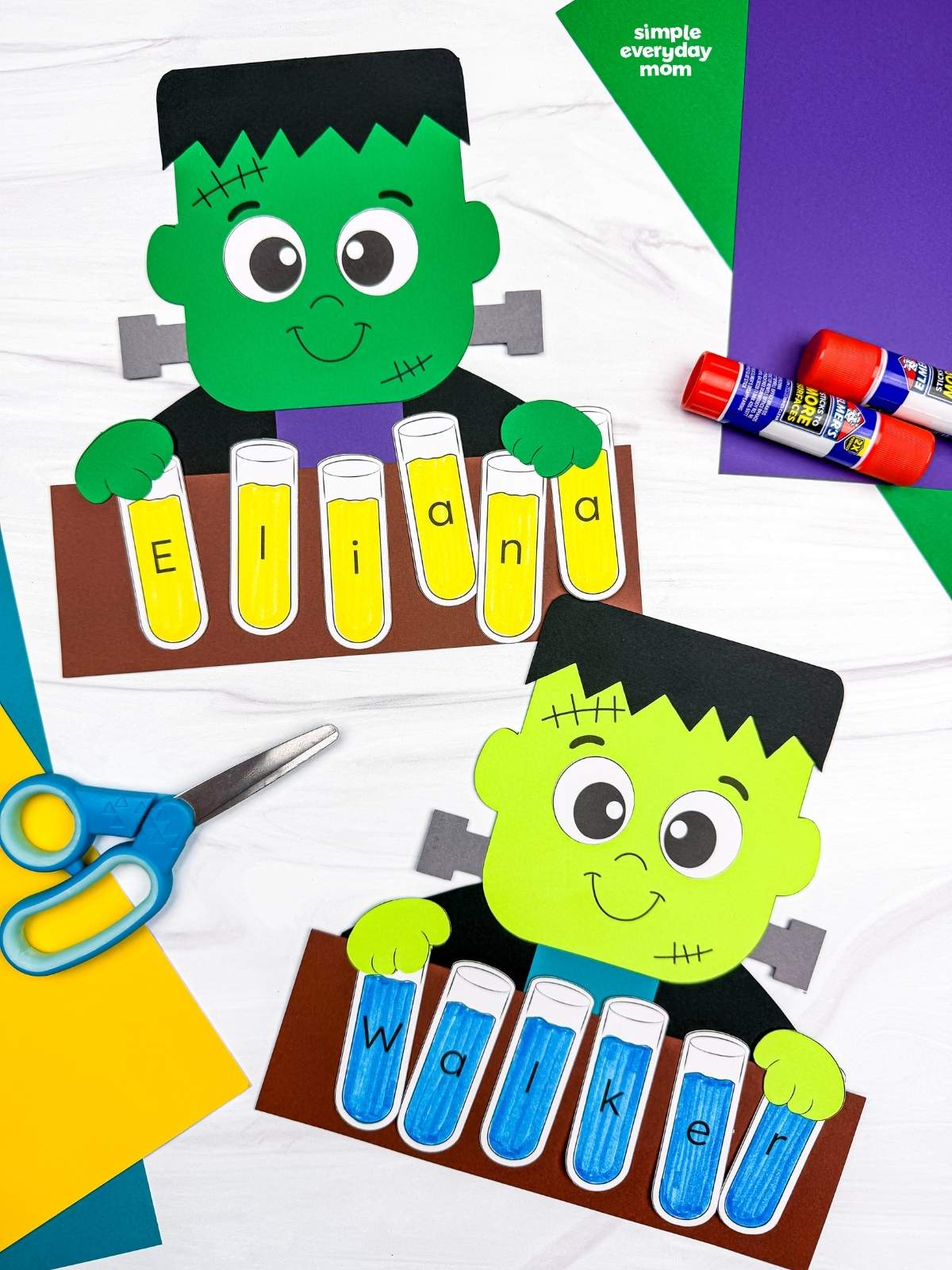 Side by side completed Frankenstein name crafts with lettered test tubes spelling each child’s name.