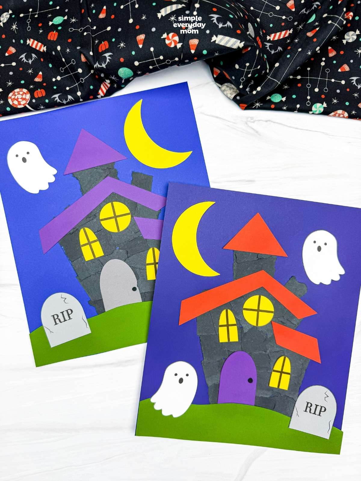 Side by side completed Haunted House Torn Paper Crafts with ghosts, crescent moons, windows, grass, and headstones.