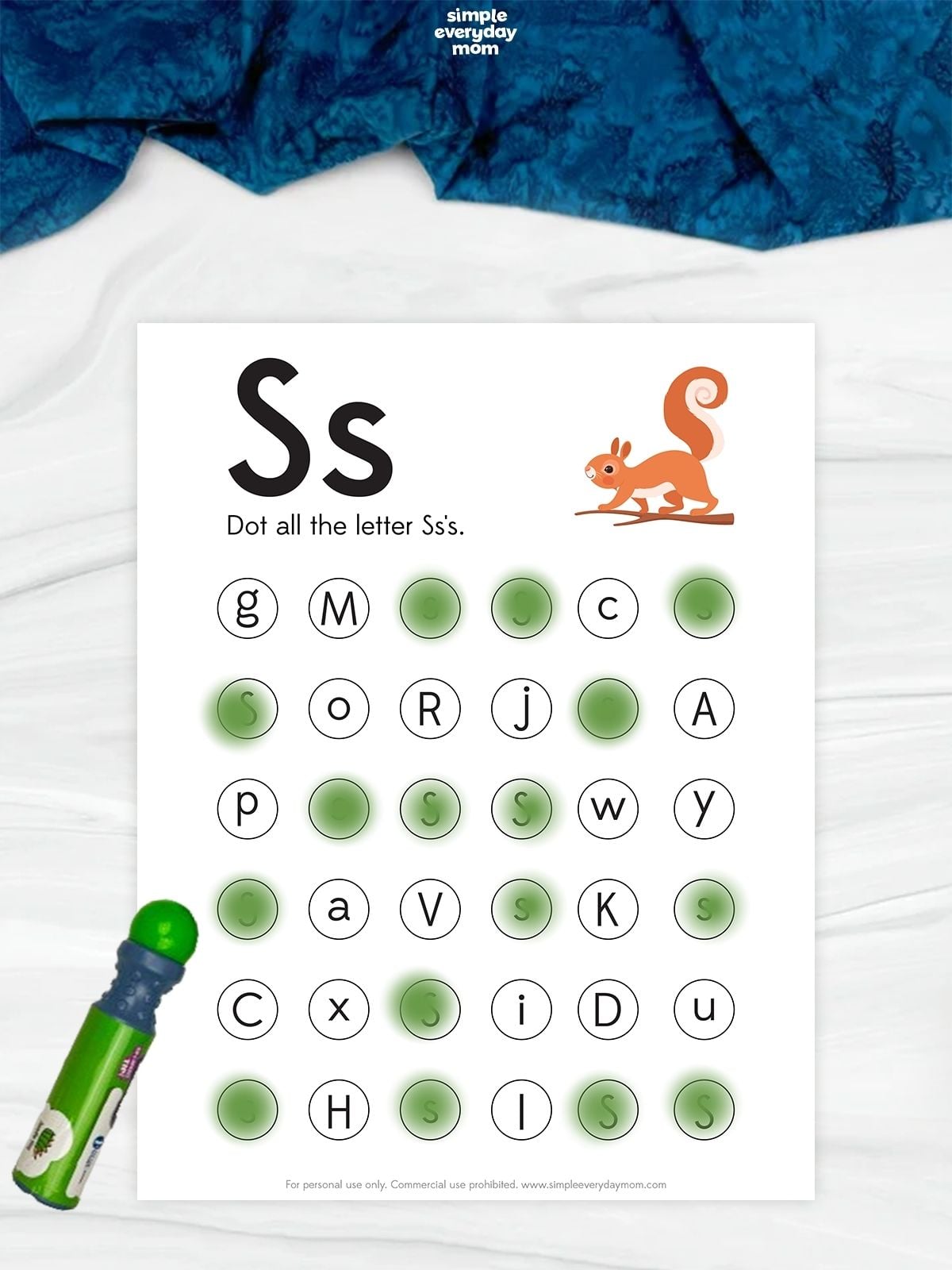 Letter S dot-marker worksheet with uppercase and lowercase S, a squirrel illustration, and a grid of mixed letters where students dot each S.