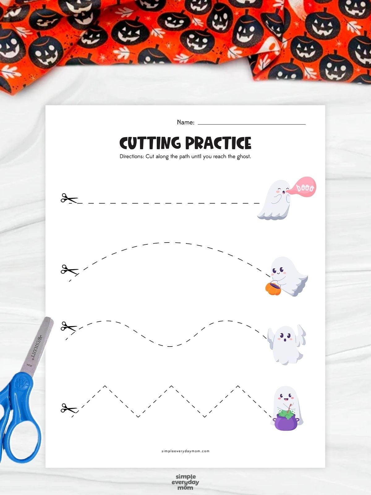 A completed ghost cutting practice worksheet featuring straight, curved, wavy, and zigzag paths for preschool scissor skills and fine motor practice.