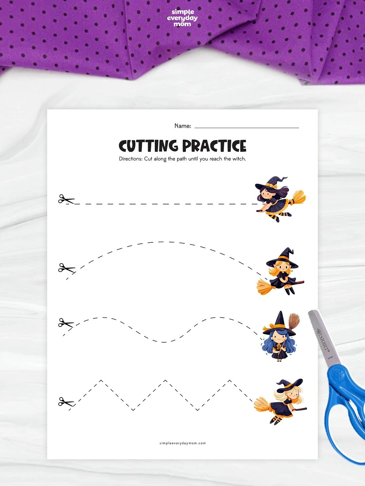 Printable witch-themed cutting practice worksheet featuring four dashed paths—straight, curved, wavy, and zigzag—each leading from a scissors icon to a cartoon witch on a broom. The worksheet instructs children to cut along each path, with blue scissors placed beside the page.