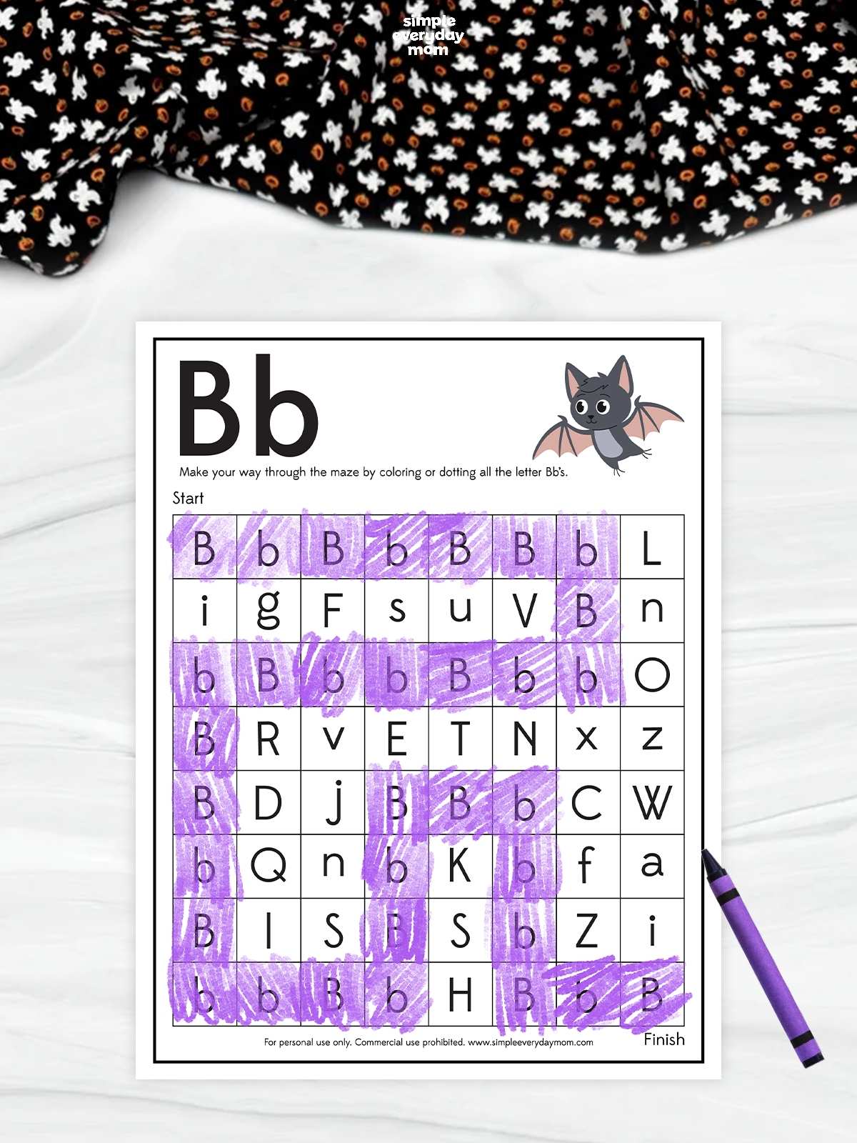 A Halloween letter B maze worksheet featuring a cute bat and purple-colored uppercase and lowercase B letters for kindergarten letter recognition and coloring practice.