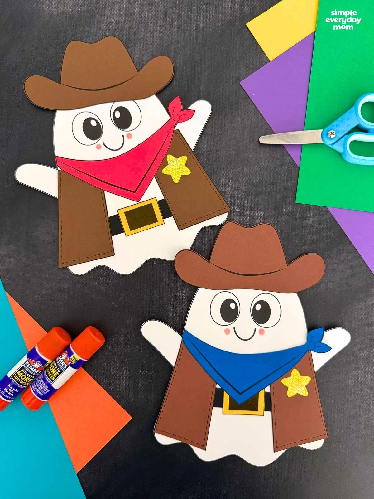A completed Craft showing two Cowboy Ghost Disguise Crafts with cowboy hats, bandanas, vests, belts, and star badges alongside craft supplies.