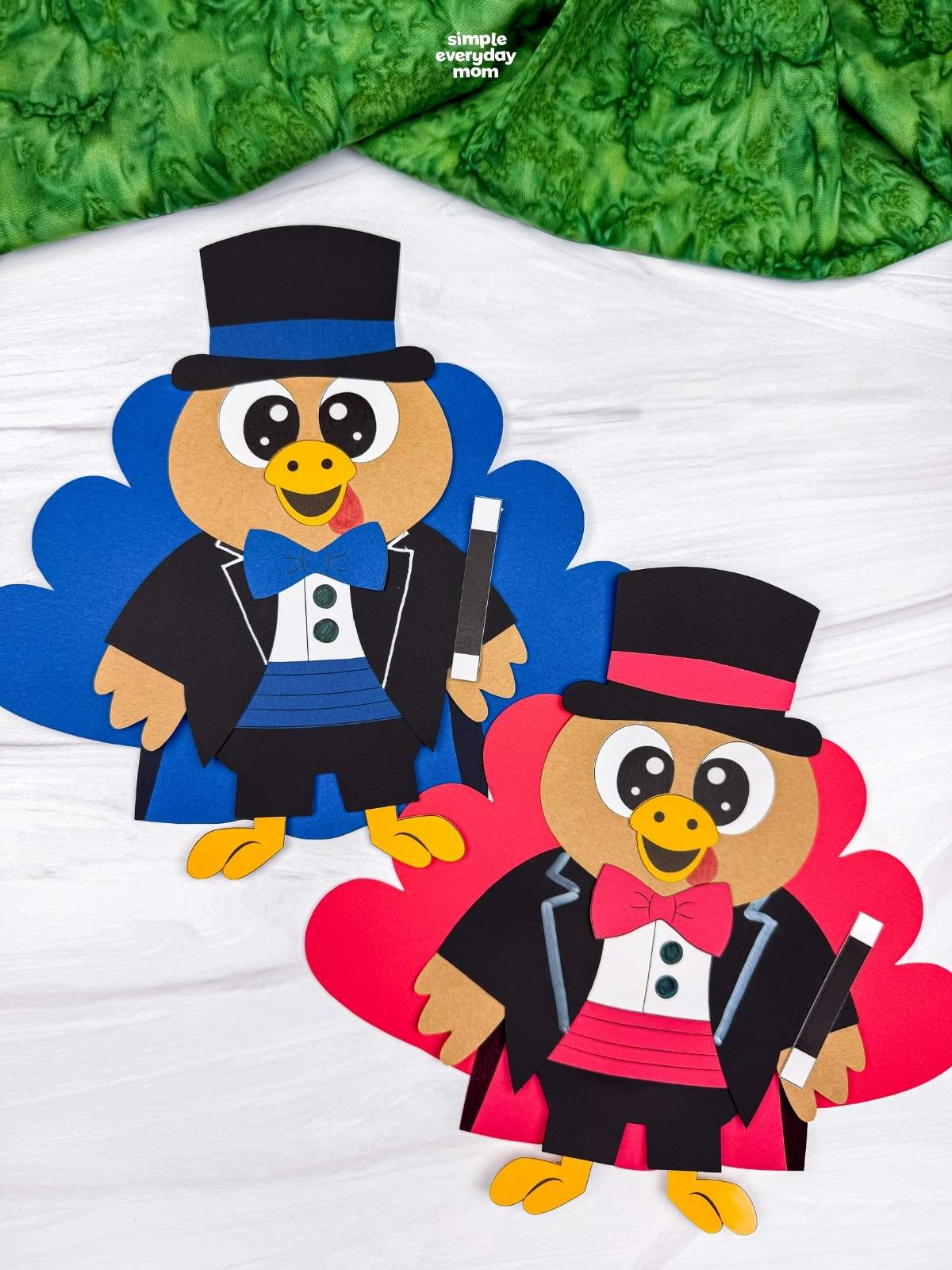 Side by side completed Magician Turkey Disguise Crafts featuring blue and red tail feathers, black top hats, matching bow ties, and magic wands.